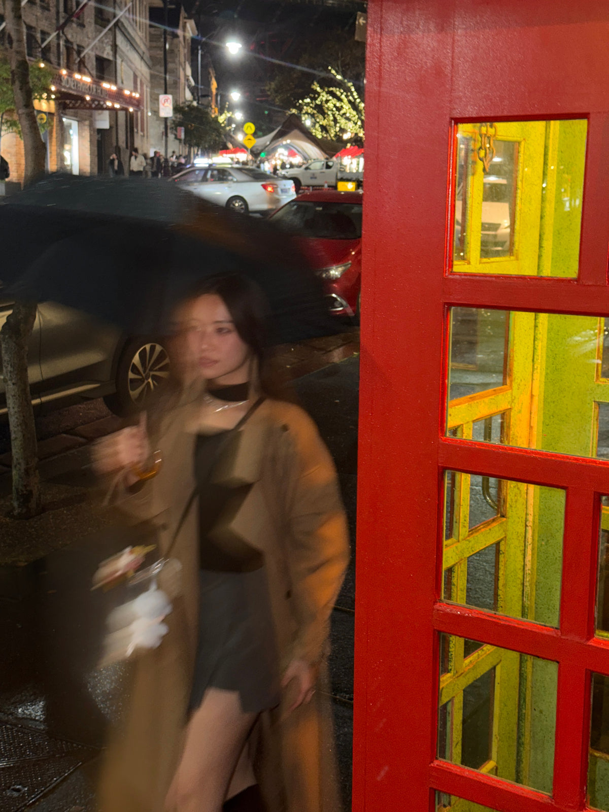 A rainy city night meets timeless trench-coat style.
